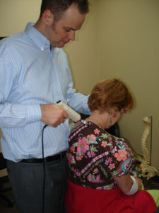 dr ryan hatch parker colorado chiropractor doing a neck adjustment on a patient