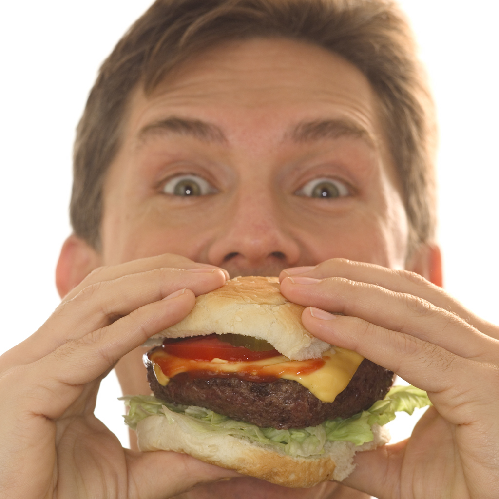man eating a cheeseburger is cholesterol ok